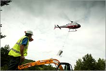 Placing concrete by helicopter at remote Highland site.